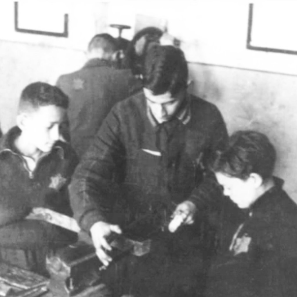 Elly Gotz, centre, in Jewish ghetto, Lithuania, 1944.